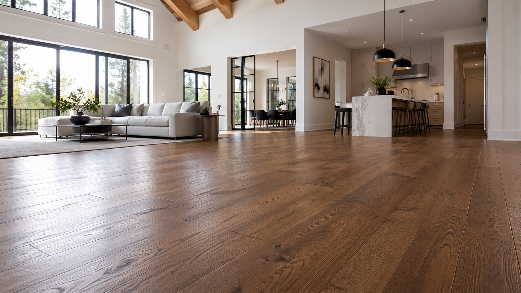 Wide-plank hardwood flooring in an open living room and kitchen